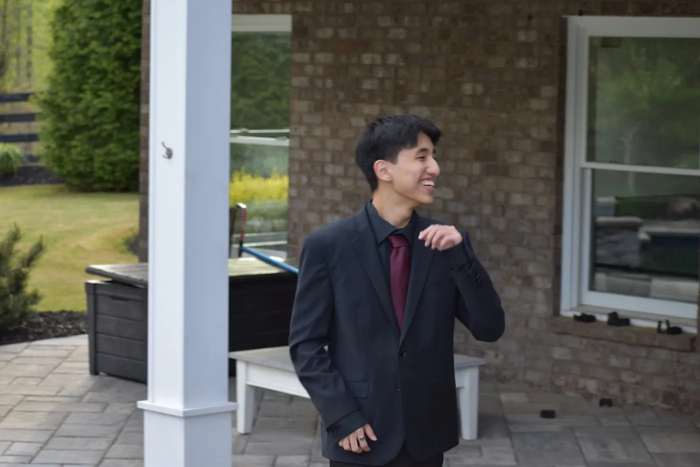 In a suit and tie before an evening event