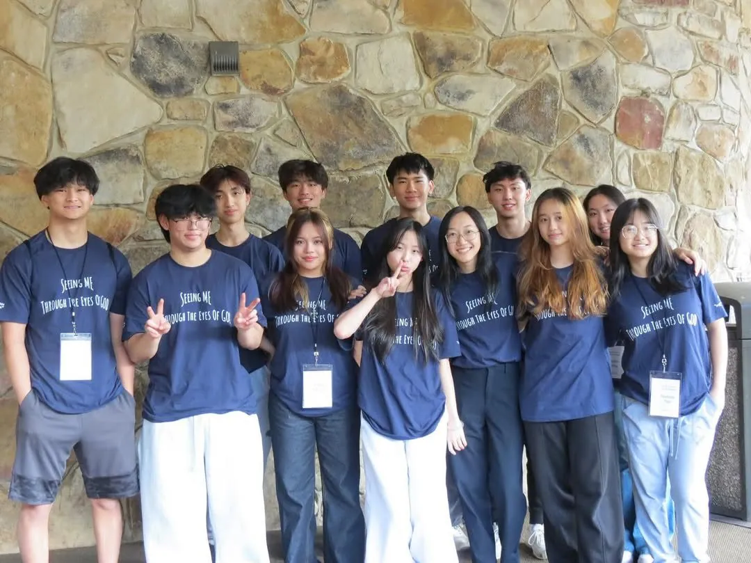 A large group in matching blue shirts