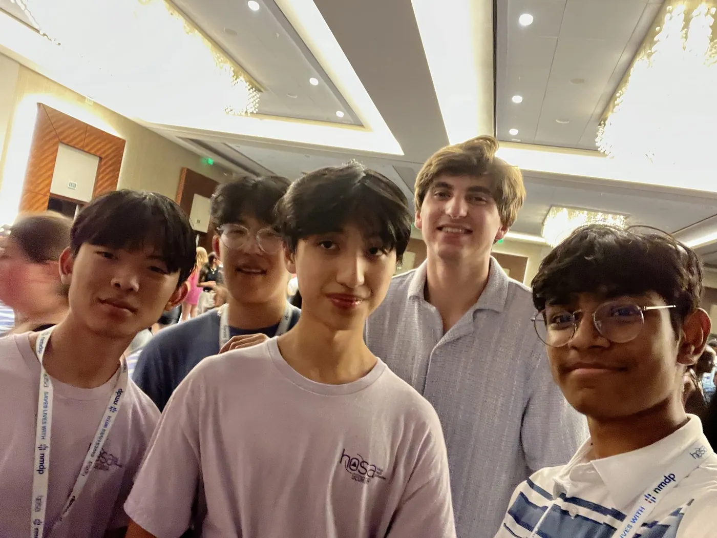 Friends packed together at an indoor event