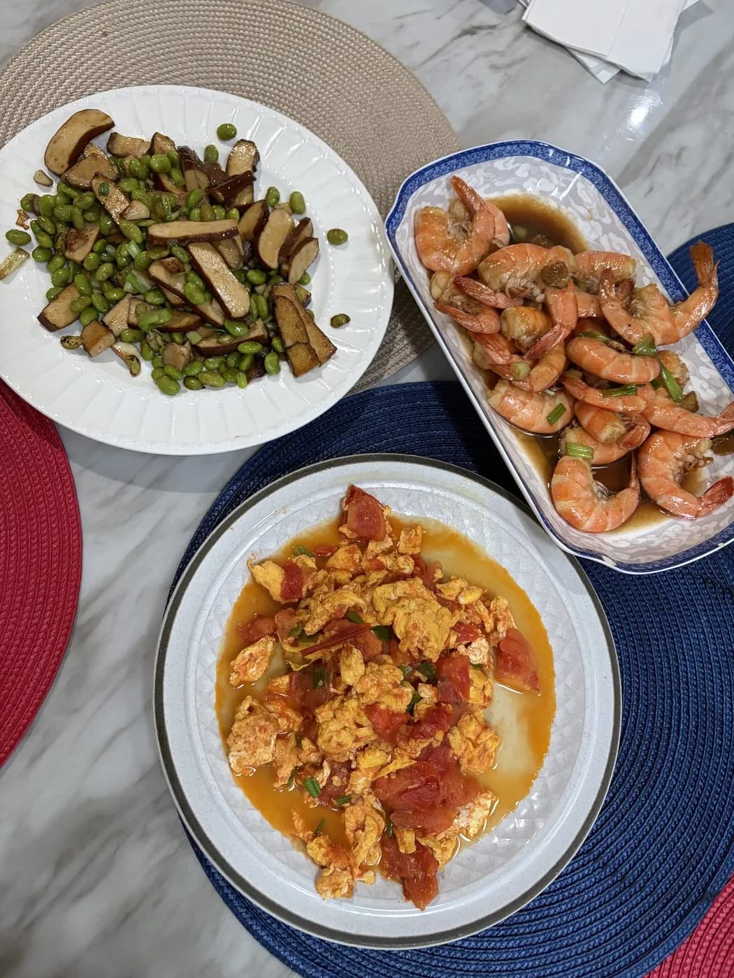 A home-cooked spread of shrimp, greens and stew
