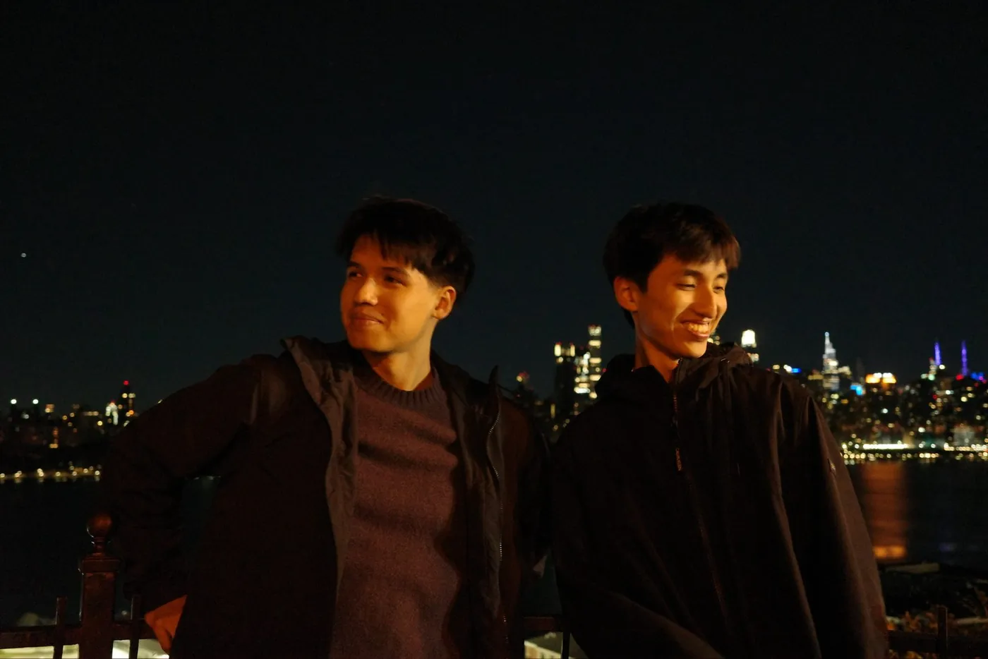 Two of us at night against the city lights