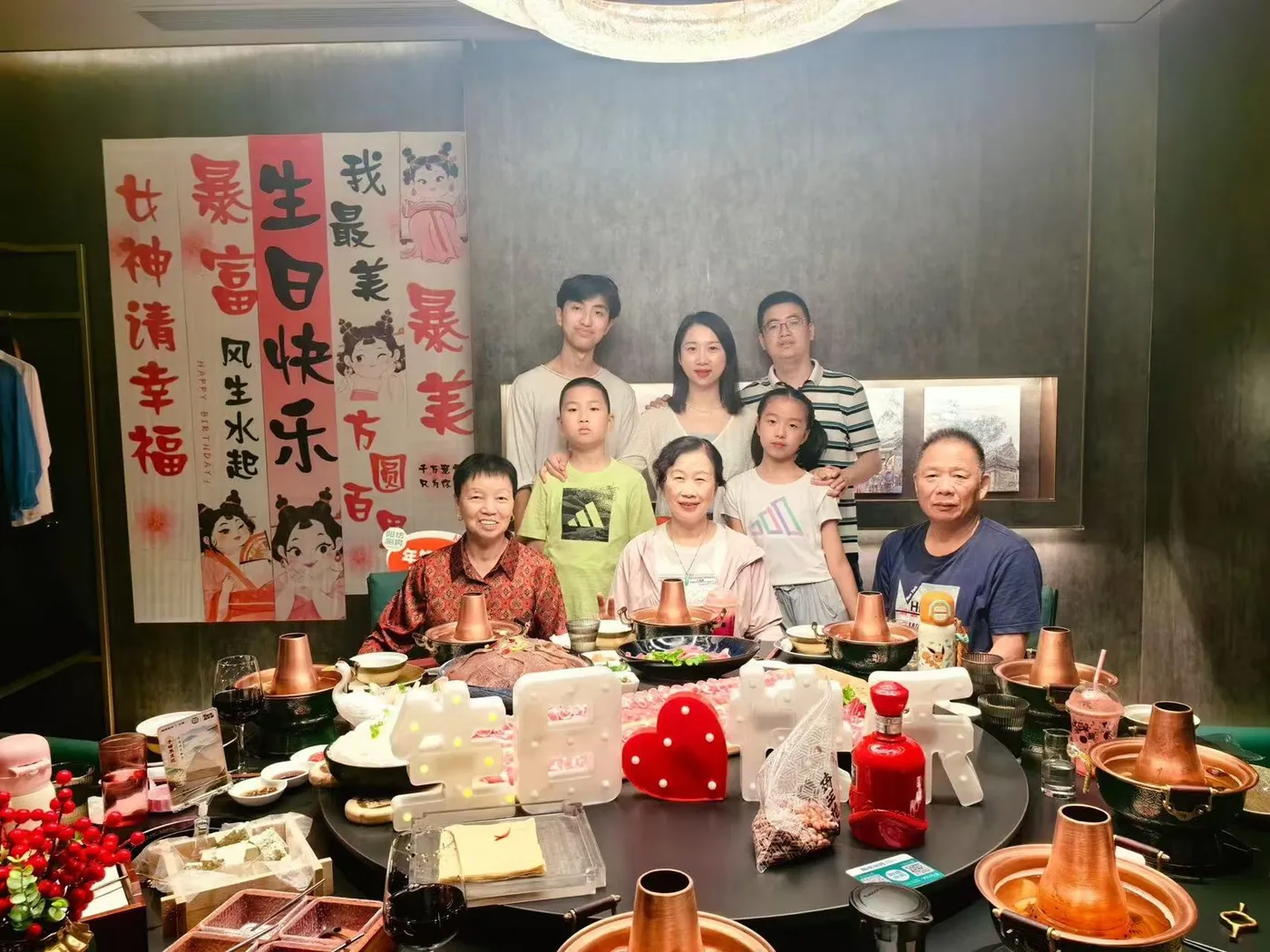 A birthday dinner around a full table