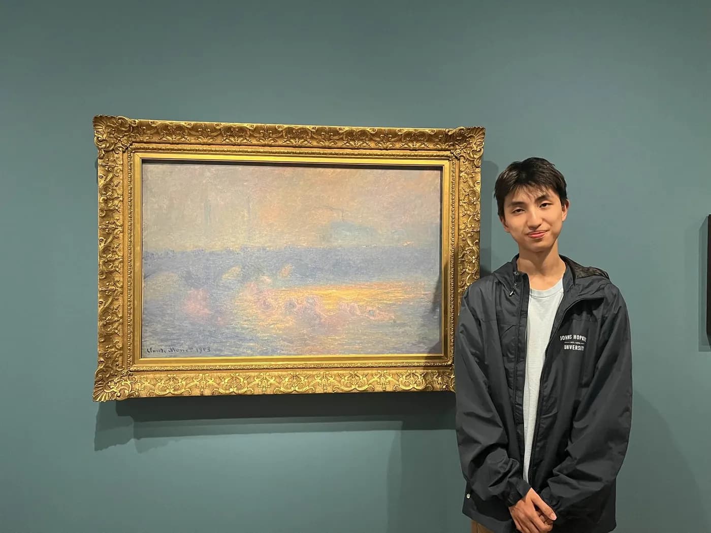 Beside a Monet seascape in the gallery